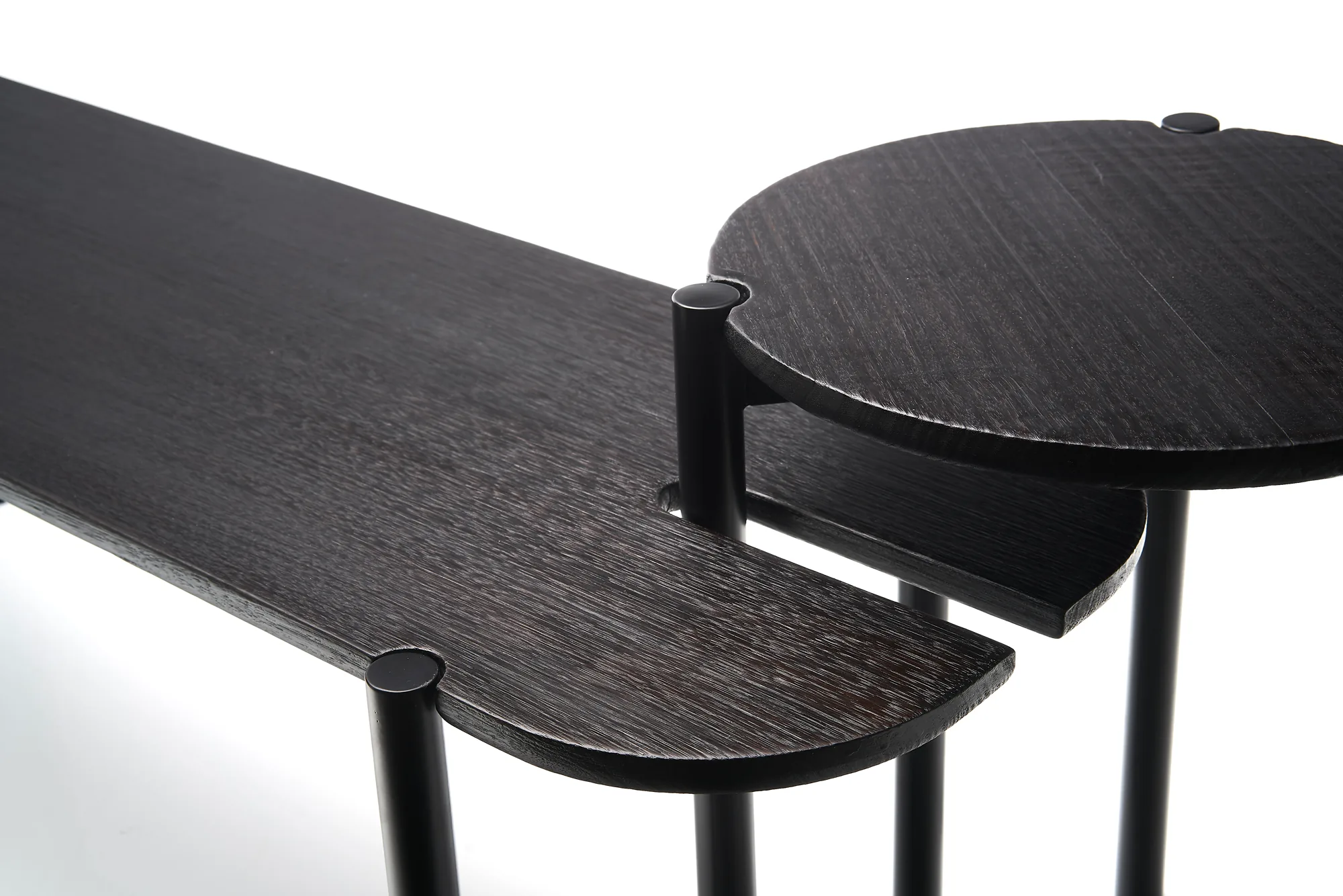 Bea bench: close-up of the side-table juncture in dark-stained ash.