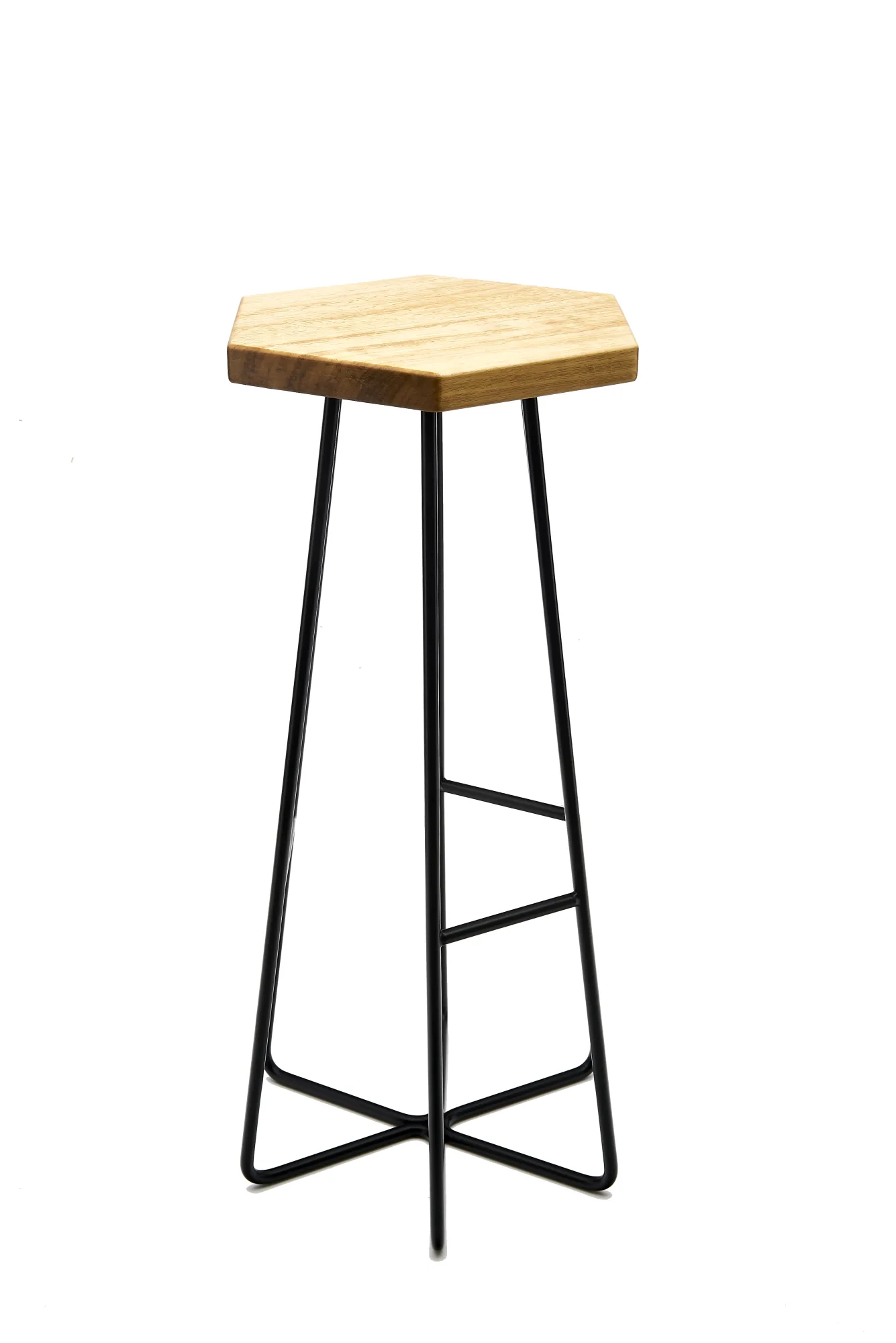 Éxi stool: studio render of the natural-oak hexagonal seat.